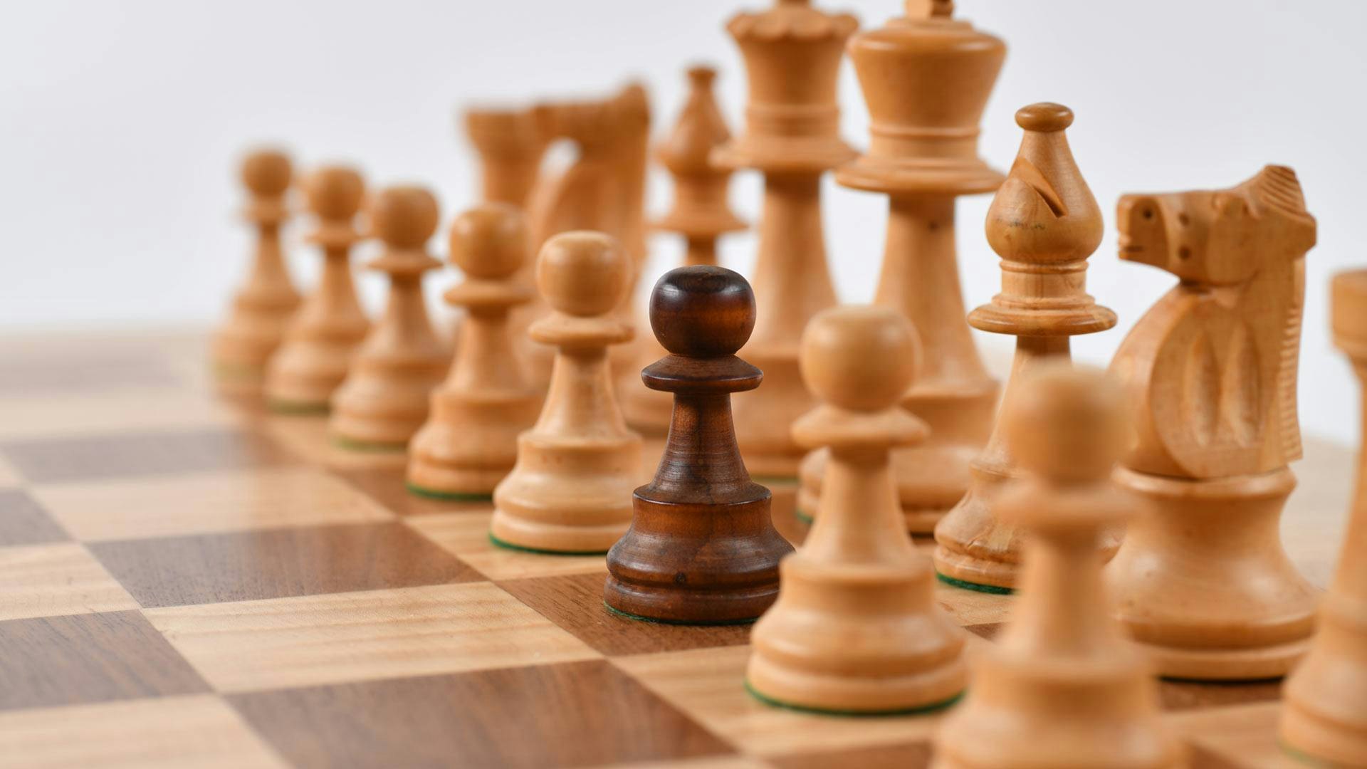 White Chess Pieces with One Black Pawn
